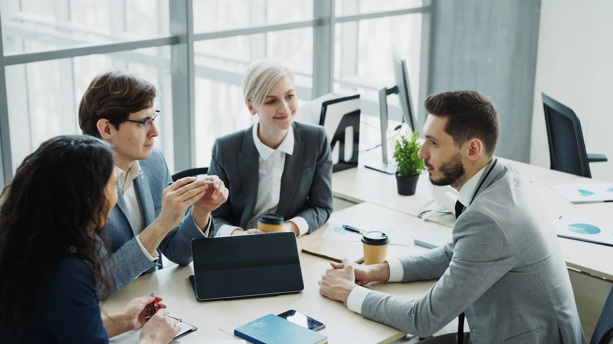 A leadership team working through documents around a meeting table
